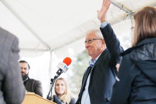 Rockne Roll/News-Register##
Yamhill County Parkway Committee chair Dave Haugeberg receives a standing ovation during the ribbon-cutting ceremony for Phase One of the Newberg-Dundee Bypass Monday, Dec. 18, along the bypass route outside Newberg.