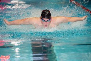 Rusty Rae/News-Register##Jace Zemlicka powering to a win in the 100 butterfly on Thursday in a duel meet against Sherwood.
