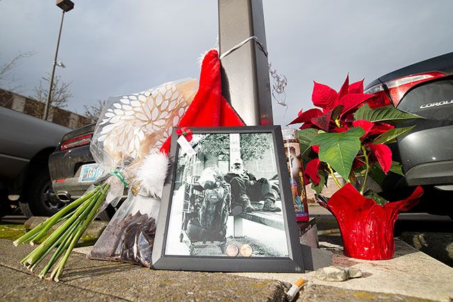 Marcus Larson/News-Register##Flowers, photos and other items were placed at the courthouse bus stop, where Stepp was often seen with his shopping cart, greeting passersby.