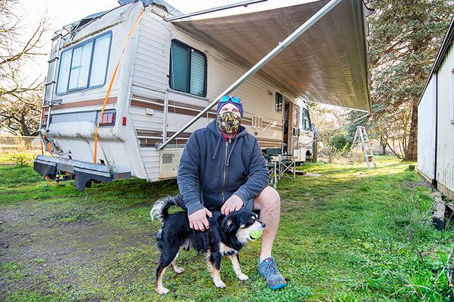 Marcus Larson/News-Register##Matteo Amante delCane lives in an RV with his dog Zeus as part of Champion Team’s car camping program. He was traveling the country in a van when the pandemic began.