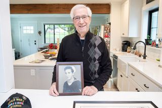 Marcus Larson/ News-Register ## World War II Navy veteran Steve Bellanco holds a photo of himself not long after joining the Navy in 1943. Soon the 18-year-old he joined 10,000 others on a troop ship headed for the South Pacific. The trip was the first time he d seen the ocean.