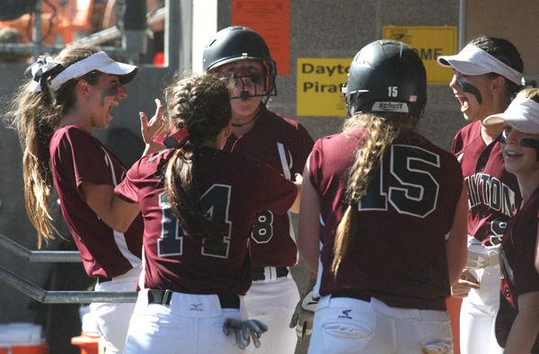 Rockne Roll/News-Register##Dayton junior Kylee Hill (8, center) celebrates her three-run home run in the fifth inning of Friday s OSAA Class 3A softball state championship game with her teammates.