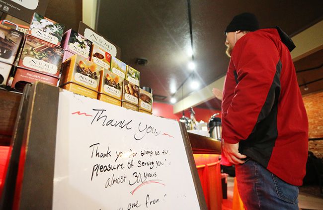Rockne Roll/News-Register##
Emil Geyer orders a beverage at Cornerstone Coffee Roasters in McMinnville on Friday, Dec. 2, next to a sign thanking customers on the shop s final day of operation. Cornerstone announced their sudden closure Thursday night.