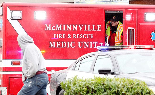 Rockne Roll/News-Register##
McMinnville emergency services personnel respond to a a pedestrian-vs.-vehicle collision at the corner of 12th and Adams Streets in McMinnville on Tuesday, March 14.