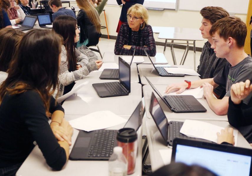 Rockne Roll/News-Register##
Education secretary Betsy DeVos discusses a poetry passage with students at McMinnville High School during her visit to the school Wednesday, Oct. 11.