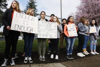 Rockne Roll/News-Register##
McMinnville High School students demonstrate during an anti-gun violence walk-out along Northeast Evans Street near the school Wednesday, March 14.