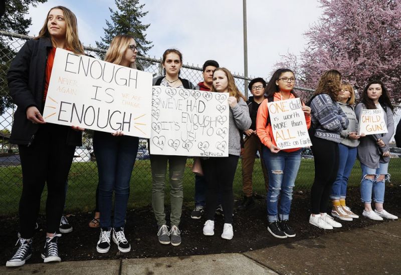 Rockne Roll/News-Register##
McMinnville High School students demonstrate during an anti-gun violence walk-out along Northeast Evans Street near the school Wednesday, March 14.