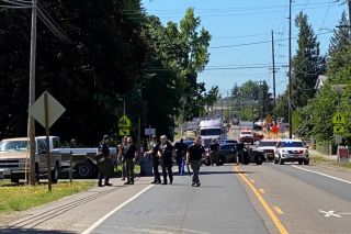 Photo courtesy Yamhill County Sheriff s Office@@Law enforcement personnel converge upon the North Trade Street (Highway 99W) area of Amity Wednesday afternoon to resolve a disturbance at a residence. An arrest was made.