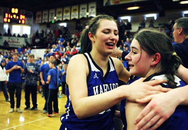 Rockne Roll/News-Register##
Keeley Graham, right, and Victoria Howard of Amity celebrate the Warriors  upset win over Salem Academy in the OSAA State Championship semifinal game between the schools on Friday, March 4 at the Pirate Palace in Coos Bay.