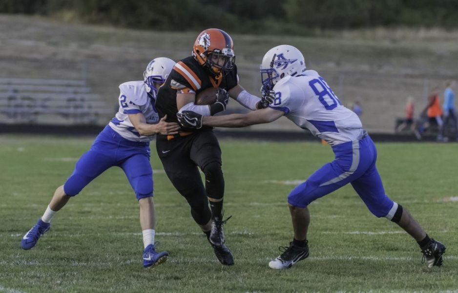 Malia Riggs/for the News-Register##
Willamina s Ian Bruckner, 20, plowed through Tommy Jackson, 88, of Amity in the second quarter to make a first down.