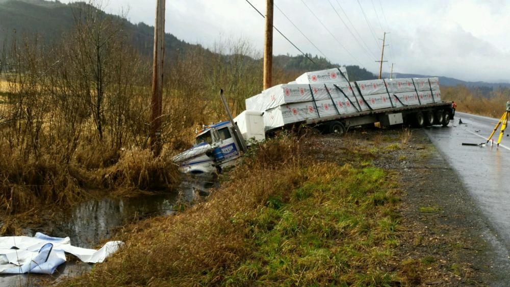 Photo courtesy Oregon State Police##This tractor-trailer rig, driven by a Sheridan man, collided with a passenger car Wednesday morning on Highway 30, killing a passenger in the car.