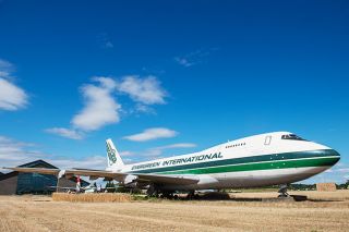 News-Register file photo##McMinnville Properties is suing County Tax Assessor Derrick Wharff over back taxes on the Evergreen 747 it acquired in a sheriff s auction last year.