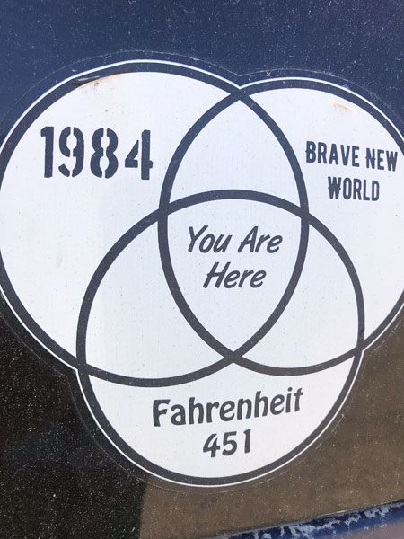 Kirby Neumann-Rea/News-Register##A vehicle decal spotted in McMinnville shows a Venn diagram illustrating the intersection of a trio of prominent works of dystopian literature.