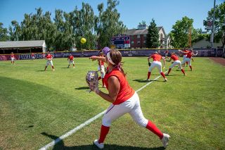 Rusty Rae/News-Register##Linfield’s Katrina Johns warms up ahead of Thursday’s game against Redlands, the first of a best-of-five series. The winner will advance to the Super Regionals.