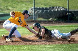 Rusty Rae/News-Register##Kaden Sutton is tagged out to end the fourth inning trying to go first to third on a single during Y-C’s 5-2 loss to Pleasant Hill on Wednesday.