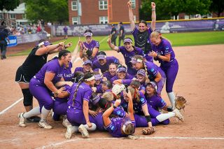 Rachel Thompson/News-Register##The ‘Cats rush the field and dogpile near home plate to celebrate their Super Regional championship, one that gives them a spot in the D3 National Championship.