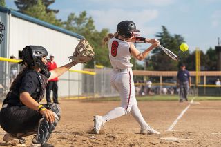Brandon Bomberger/News-Register##Peyton Justice went 2-for-3 with an RBI in McMinnville’s season-ending defeat to Sherwood on Friday.