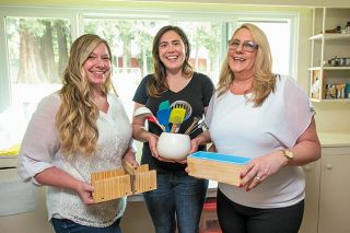 Rusty Rae/News-Register##Sisters Stephanie Stoutenburg and Alexandra “Ali” Sauer work with their mom, Leona McNickle, to make soap using natural ingredients. They call their McMinnville company Mahonia Roots.