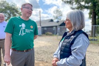 Starla Pointer/News-Register##Blanchet House Executive Director Scott Kerman talks to board member Alisa Sinnott at a gathering  celebrating the start of construction on Blanchet Farm’s new dorm project. The working farm near Carlton houses men who are recovering from addiction.
