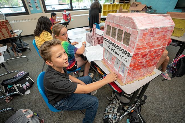 Rachel Thompson/News-Register##Isaak Thompson said he chose to research and build a model of the old department store at Third and Evans streets because he liked how it says “JC Penney Co.” on the façade. He and his second- and third-grade classmates at St. James School each studied one of the historic downtown buildings.