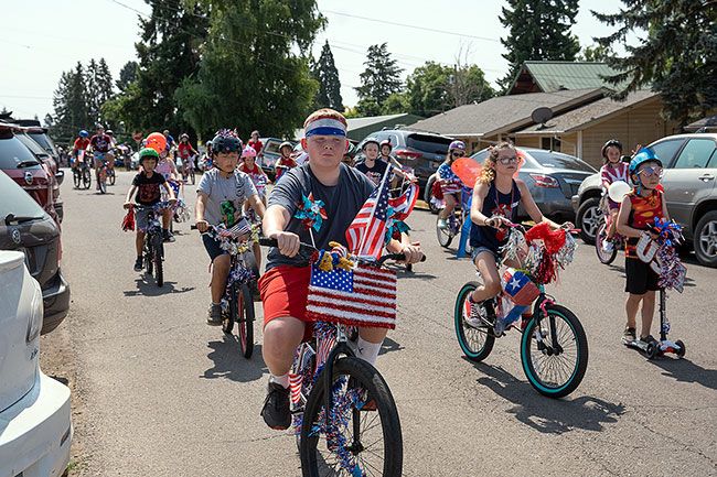 News-Register file photo: Youth will gather at Wascher Elementary in Lafayette at 9:30 to decorate their bikes before peddling through the annual parade starting at 10:30 p.m.