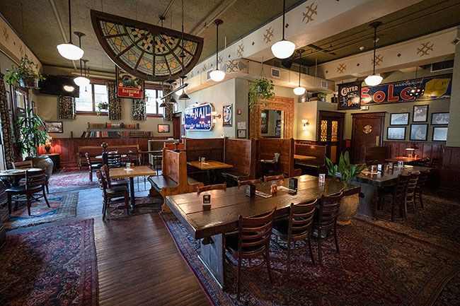 Rachel Thompson/News-Register##The Hotel Oregon features wood and other details from when the structure was built in 1905. This area of the restaurant dining room previously was known as the Paragon Room, but was used for expanded seating during the pandemic.