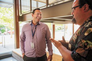 Rusty Rae/News-Register##New McMinnville High School Principal David Furman, left, talks with teacher Adam Gray during a summer school session this month. Furman, who replaced Amy Fast, is getting to know his staff and students.