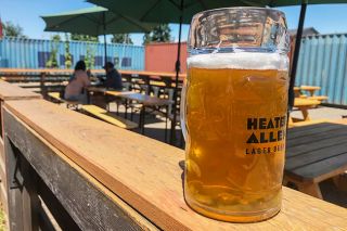 Kirby Neumann-Rea/News-Register##Heater Allen has expanded its beer garden and named it Gold Dot Spot, after the brewers’ new specialty line of lagers. Repurposed cargo containers frame the outdoor beer area, with more decor, amenities and seating planned.