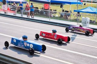 Leann Alexander/Submitted Photo##Brady Alexander, seen in the blue car in the forefront, races in the All-American Soap Box Derby World Championship in Akron, a place he dreamed of racing in honor of his grandpa.
