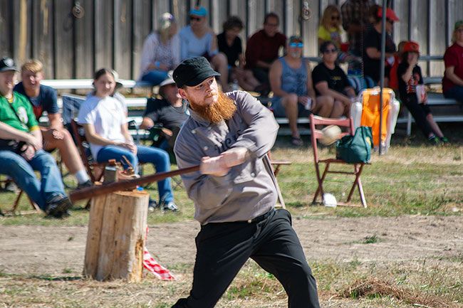 Tanner Russ/News-Register##Jesse “Duh Duh” Maxwell takes a big swing as striker. The arbiter had threatened to fine Maxwell for having a beard that “interfered with the plate.”
