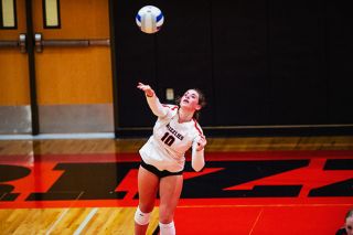 Rusty Rae/News-Register##McMinnville’s Finley Arzner was a force at the net, getting a crucial block and kill to help win the fourth set against Forest Gove.
