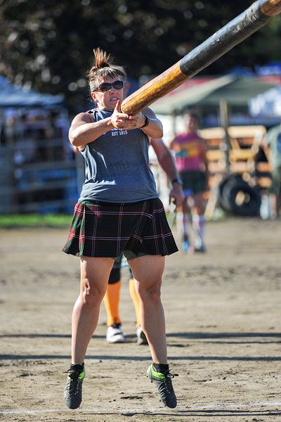 Rachel Thompson/News-Register file photo##Kerry Rubert Bentley of Auburn, Washington, participates in the caber-tossing competition at last year’s McMinnville Scottish Festival. The event returns this weekend to the Yamhill County Fairgrounds.