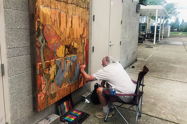 Kirby Neumann-Rea/News-Register##“I just start with a line,” said artist Neil Lawson, a retired Linfield custodian who was invited to create a large panel of art, one of many works on the outside of the Miller Center for the Arts. The untitled piece is on temporary display.