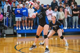 Rusty Rae/News-Register##Amity junior Saralynn Grove passes the ball in the team’s playoff game against Lakeview.