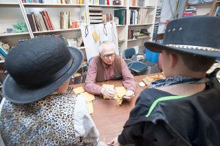 News-Register file photo##Ken Rogers demonstrates leathercraft to elementary school students during Pioneer Days in 2014 at the Yamhill Valley Heritage Center.