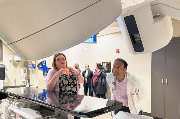 Kirby Neumann-Rea/News-Register##Hoover Center radiation therapist Jennifer Sandels-West describes the linear accelerator technology to surgeon Sandeep Kumar, MD of Willamette Valley Medical Center, during Tuesday’s tour.
