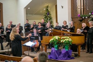 Rusty Rae/News-Register##Music nearly 300 years old still gets people into seats, then on their feet: Robin Pederson, left, conducts 50 singers and musicians in George Frideric Handel’s “Messiah” before a packed sanctuary Friday and Saturday nights at McMinnville First Presbyterian Church. Performances culminate in the revered “Hallelujah” chorus, for which the audience rises for the finale.