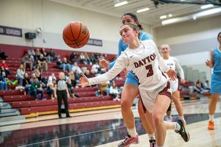 Rusty Rae/News-Register##Dayton freshman Bella Lopez leaps for an offensive rebound against Oregon Episcopal.