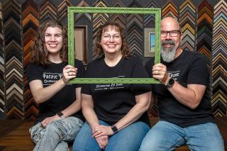 Rusty Rae/News-Register##Daughter Jaz and parents Leigh Ann and Noel Jones say they will frame just about anything at their Pacific Frame & Gallery, which is celebrating its 25th anniversary in McMinnville this year. They custom make every frame; customers can choose colors, dimensions and styles.