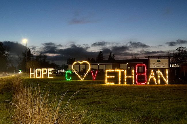 Kirby Neumann-Rea/News-Register##A lighted message with 6-foot-tall letters honors Ethan Kearns and the late Cosme Velazquez at the intersection of Highways 99W and 18 at the east end of McDougall Road.