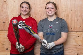 Rusty Rae/News-Register##Kansas softball’s Abigail Carsley (right) and Liberty softball’s Brynn McManus (left) both graduated from Mac High after playing softball, but never played together. Yet both turned out D-I softball athletes.