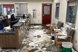 Photo courtesy of Dayton schools##Sodden, crumbled ceiling tiles litter the floor, furniture and window valances in the Dayton district office after pipes burst over the weekend and caused flood damage. A hallway and three classrooms were also flooded.