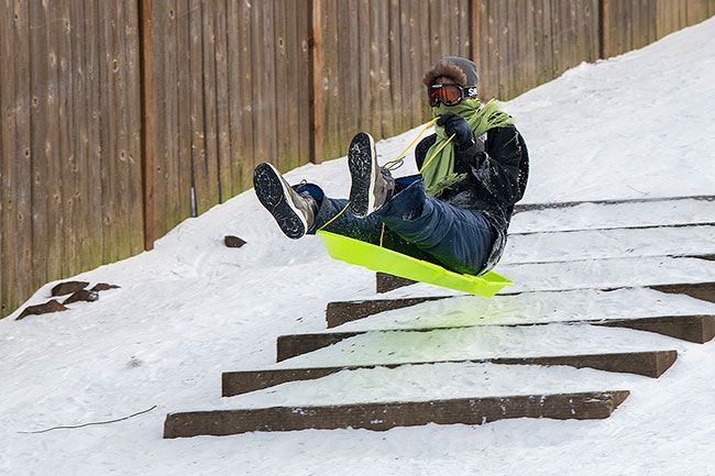 ##Bryden Hardy catches a little air as he launches off a set of steps near Wallace Road. The steps added some texture to the 
snowy hillside.