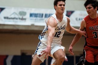 Otto Davies/for the News-Register##Linfield senior Jackson Dupree was one of two Wildcats with a double-double against Pacific, scoring 12 points with 10 rebounds. Garrett Callsen was the other.