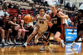 Otto Davies/for the News-Register##Linfield graduate student Janessa Yniguez drives into the paint against Pacific. Yniguez recorded six points in the loss to the Boxers.