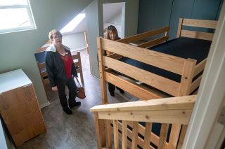 Rusty Rae/News-Register##YCAP board member Arlene Worden, left, and staff member Michelle Whiting tour one of the six bedrooms at the renovated Newberg Navigation Center.