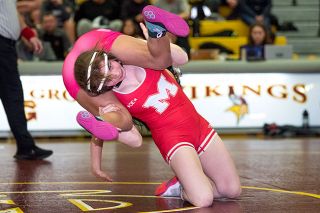Rusty Rae/News-Register file photo##Mac’s Sophia Dunckel won both of her matches in the 105-pound bracket at the Tualatin Girls Invitational at Tualatin High School on Saturday, Jan. 27. Dunckel, a commit to Linfield University’s wrestling team, has been strong for the Grizzlies.