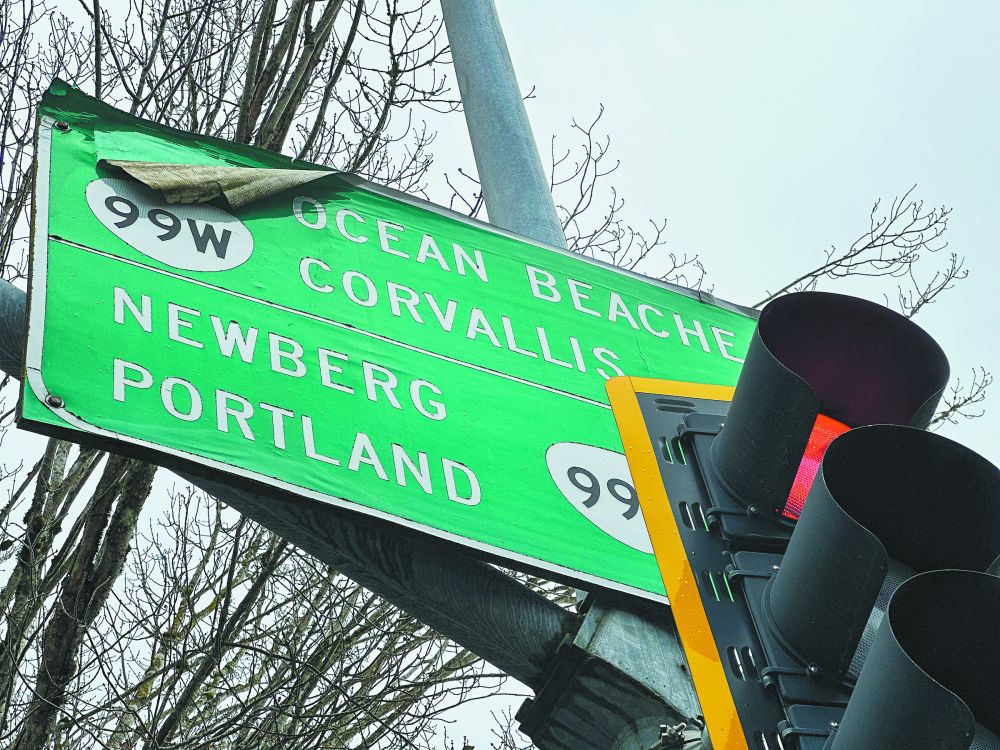 Kirby Neumann-Rea/News-Register## State sign at Third and Baker streets (Highway 99), among the city’s busiest intersections, and signage with a key set of regional directions obscured.