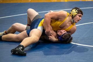 Rusty Rae/News-Register##Sheridan’s Allesandro Depiero works for a pin against his opponent at the district wrestling meet hosted by Sheridan High School on Feb. 10.
