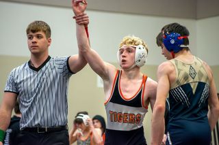 Tanner Russ/News-Register##Yamhill Carlton’s Alex Shipman gets his hand raised after his championship win.